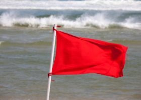 Red flag on the beach Red flag on the beah