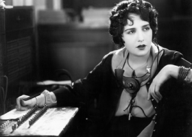 Young woman working as a telephone operator Young woman working as a telephone operator