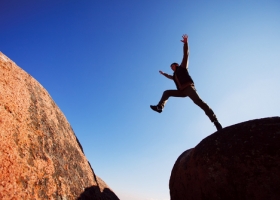 Man jumping cliff Man jumping cliff